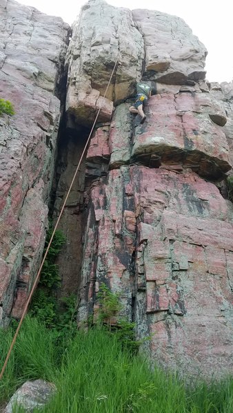 Alex is getting ready to crank thru the crux on Mean Streak