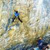 Rhys Beaudry cranking trough the first crux of Janus, 12b.