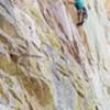 Jared Guglielmo in the middle of the crux. A good piece can be had here but it is fiddly and the stance is tenuous. If you fall  before getting it and the really bomber looking piece was to fail, you deck out.