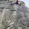 A climber after the crux on Quickstep when it meets with Hair Line.