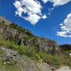 The approach trail goes up scree to the left.