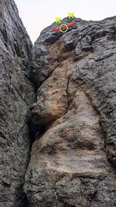 A good face on picture of the wall. Notice that if you use the bolts to the right of the crack (yellow X's), there is a lip (red line) that you should extend your anchor point below. 2 25 ft pieces of cordollette tied as loops is what would be ideal.