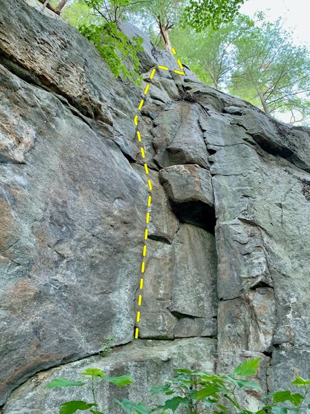 Castor climbs the left-side cracks, under the large block about 10 feet up on the right.