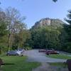 The south face from the parking lot. Crackerjack is the crack system to the right of the leftmost light-band on the wall