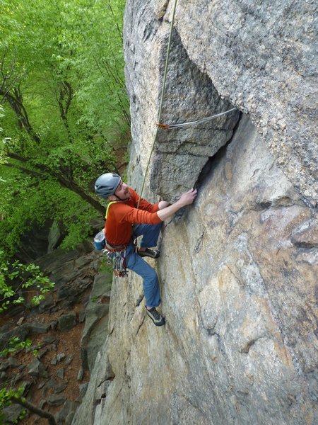 Mid-way up the first pitch. This may be the crux. Unless it the move at the top of the pitch. Or the blankish section just below this spot.