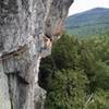 Jon starting out on the Acme Traverse.  The route continues through the prow feature, following the horizontal crack