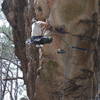 Climber during crux sequence at the roof of Furnass 5.12a