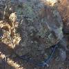 A 35/40 ft piece of cord wrapped around this perfect boulder atop the Canary Buttress provides an anchor/rappel point for 8 or nine of the routes on this buttress. If you zoom in you can see a bolt in the rock above the biners...bummer/unnecessary imho