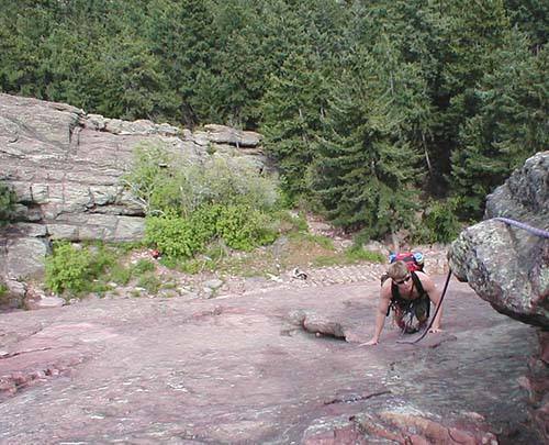 Greg Robertson pulls around the ledge at the base of the route.