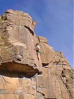 Josh Campbell stands triumphant above the roof.