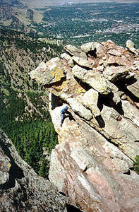 Gary Ellis downclimbs to us on the summit.