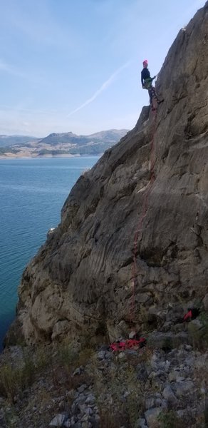 Dani at the top of a stretching moderate route in Şahinkaya Canyon.