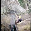 Anthony #2 (Aussie) follows the crux overhang of The Diving Board. Photo by Tony Bubb, 1996.