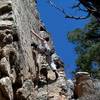 Climber at the first bolt of Concentrated Weirdness