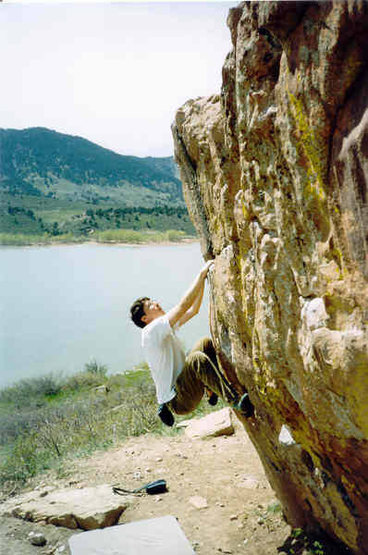 Andrew Gram on the Penny Lunge V0+ at Horsetooth Reservoir.