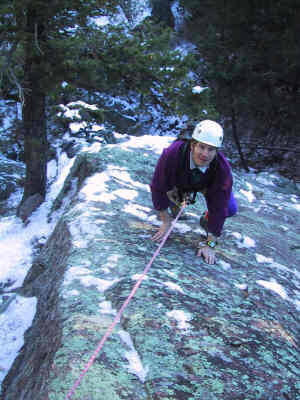 Mark Oveson at the top of the first pitch of Lichen Wars. Not content with a normal challenge Mark and his minions, did this climb on a snowy / icy day in November. Smart? not really....<br>
<br>
Photo by George Bell.