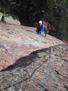 Warren Teissier near the top of the second pitch of the East Face, Satan's Slab.
