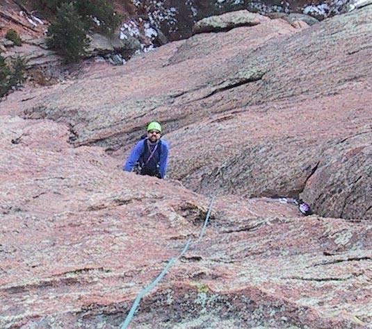 A closeup of the last shot showing the #4 Camalot better.  George Bell on the East Face of Satan's Slab.  Photo by Warren Teissier.