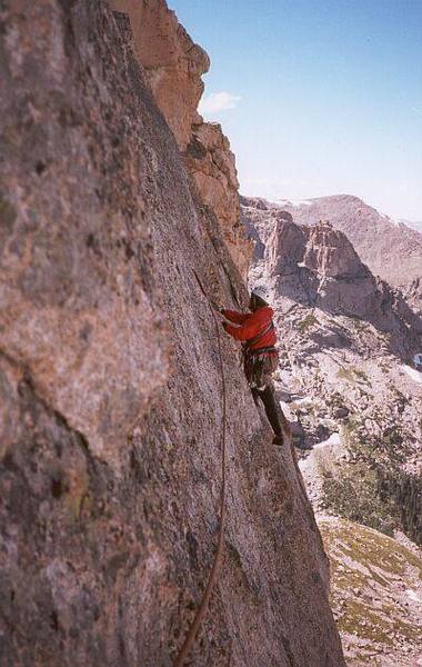 Joseffa Meir leading the airy 5.7 traverse pitch of Sykes Sickle on the Spearhead (RMNP).<br>
<br>
Photo by Tony Bubb.