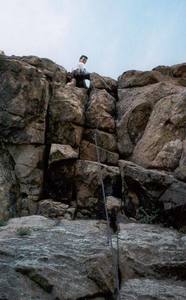 Mark Speiker Leads the crux roof of West Overhang on Eldo's Wind Tower.  Photo by Tony Bubb.