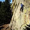 justin dubois on the non descript but fun face climbing below the corner on Xanadu.