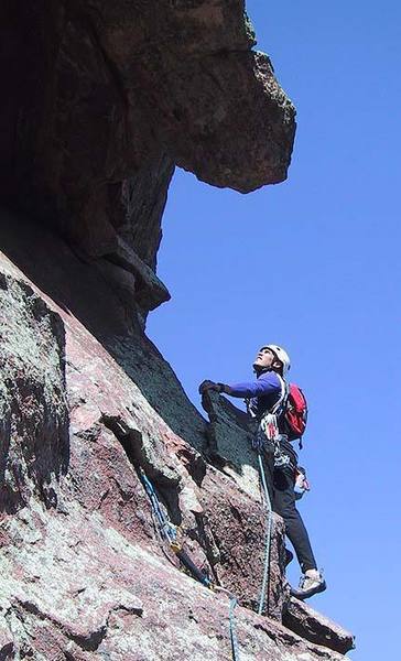 Warren Teissier approaches the crux of the SE Arete on the Second Flatiron.  The overhang above him is a giant flake that one must surmount and climb the opposite side of.