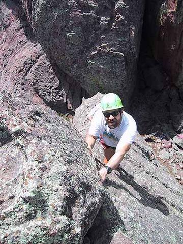 Looking down the West Ridge of Tiny Tower. George Bell is at the crux.<br>
<br>
Photo by Mark Oveson.