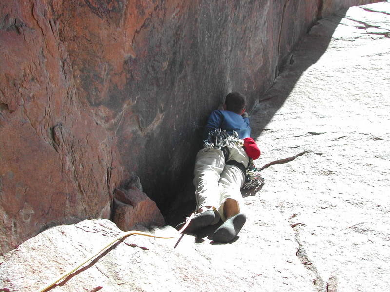 Joshua Janes starting the thin second pitch by placing gear as high as he can.  I don't blame him.