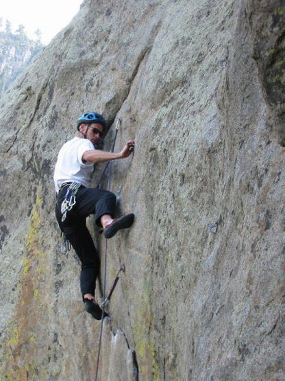 Bill Wright searching for a foothold at the lower crux.