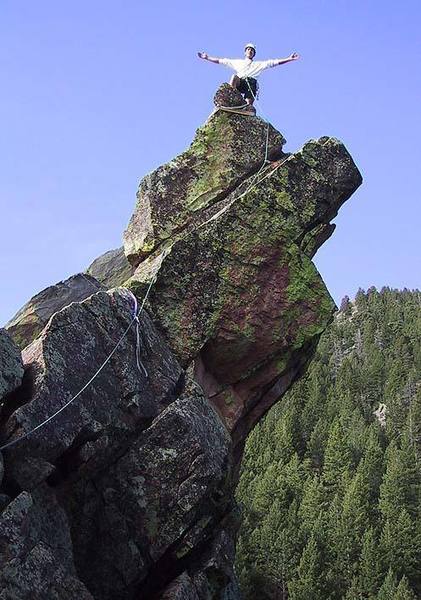 Warren Teissier on the spectacular South summit of Overhang Rock.  The rope follows the 5.5 "downclimb route" on the north side.  This photo was taken from the notch between the summits.