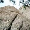 Climber working up Wes Bound (background) and the Whine Cellar (foreground)