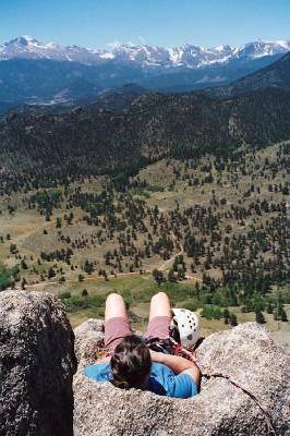 Janet relaxing in the rockalounger at the top of Osiris.  This perfectly (depending on butt size) dished out rock seat even has a hole in the bottom for your chalk bag!