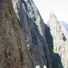 Charles nearing the end of the crux splitter on Comic Relief.  Photo taken by Bernard Vachon from the first belay of Escape Artist.