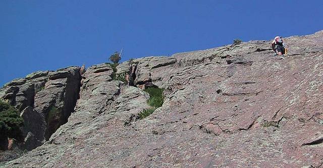 Looing up the middle section of the route showing the 4 Cat Scratch chimneys/gullies.  The tree on the skyline is between the 4 scratches (2 left or it, 2 right).