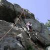 Ari cleaning the 'draws (from top rope) a few <br>
moves below the crux.