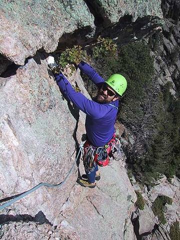 The spectacular hand traverse at the end of pitch 1.