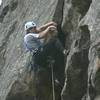 Mark Robbins pulling the crux overhang on the first pitch by Alan Whittern.