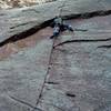 Bryan pulling the crux with cold fingers.