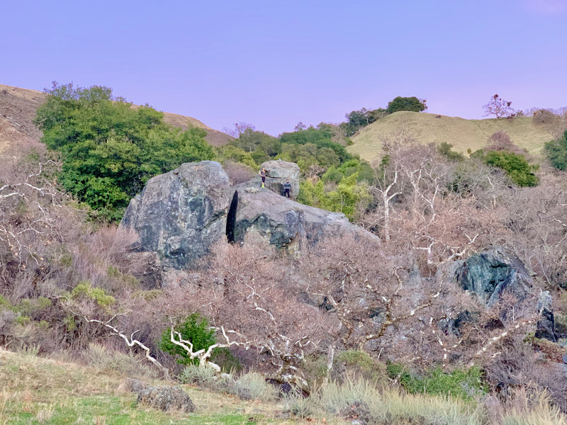 Looking northeast at the crag. Cleavage Rock on the left, Edge rock with the guy standing on it, and the bouldering area to the right.