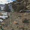 A cairn marks the path up the drainage to the cliffband.