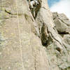 Working the toprope on the lower part of the face right before the early crux.