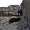 Looking up initial corner of pitch 3. There was a good rap station just above the climber, probably the best place to make a double rope rappel down to the pitch one anchor.