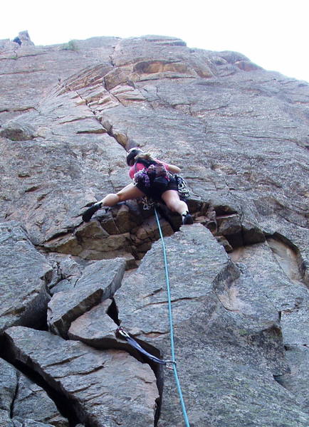 Christa Cline leading the crux hand crack on the first pitch.