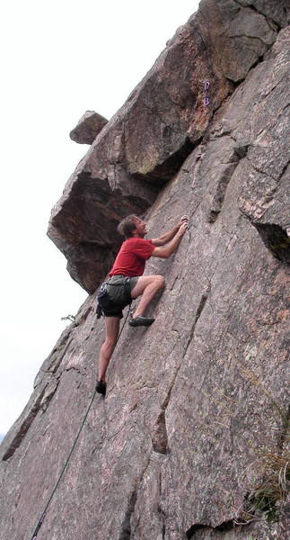 Peter Dillon on thin edges below the roof.