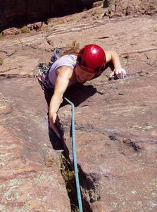 Christa Cline cranking over the roof on the second pitch.