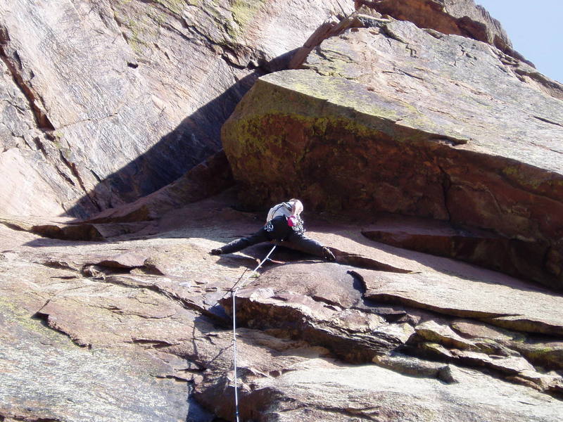 After the undercling moves on the big flake. You approach these moves from the tiny, left-facing corner on the right. The bolt above the crux is just below the climber. You can put a big cam in the flake (blue/#3 Camalot) but would it hold, or would it blow the flake?