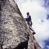 Leading the crux moves on the Barb.