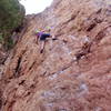 Jean Aschenbrenner working into the committing crux layback.