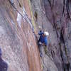 Starting the crux finger crack on pitch 3.