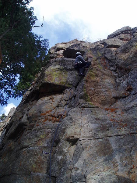 The route steps left underneath the ceiling above Chuck.